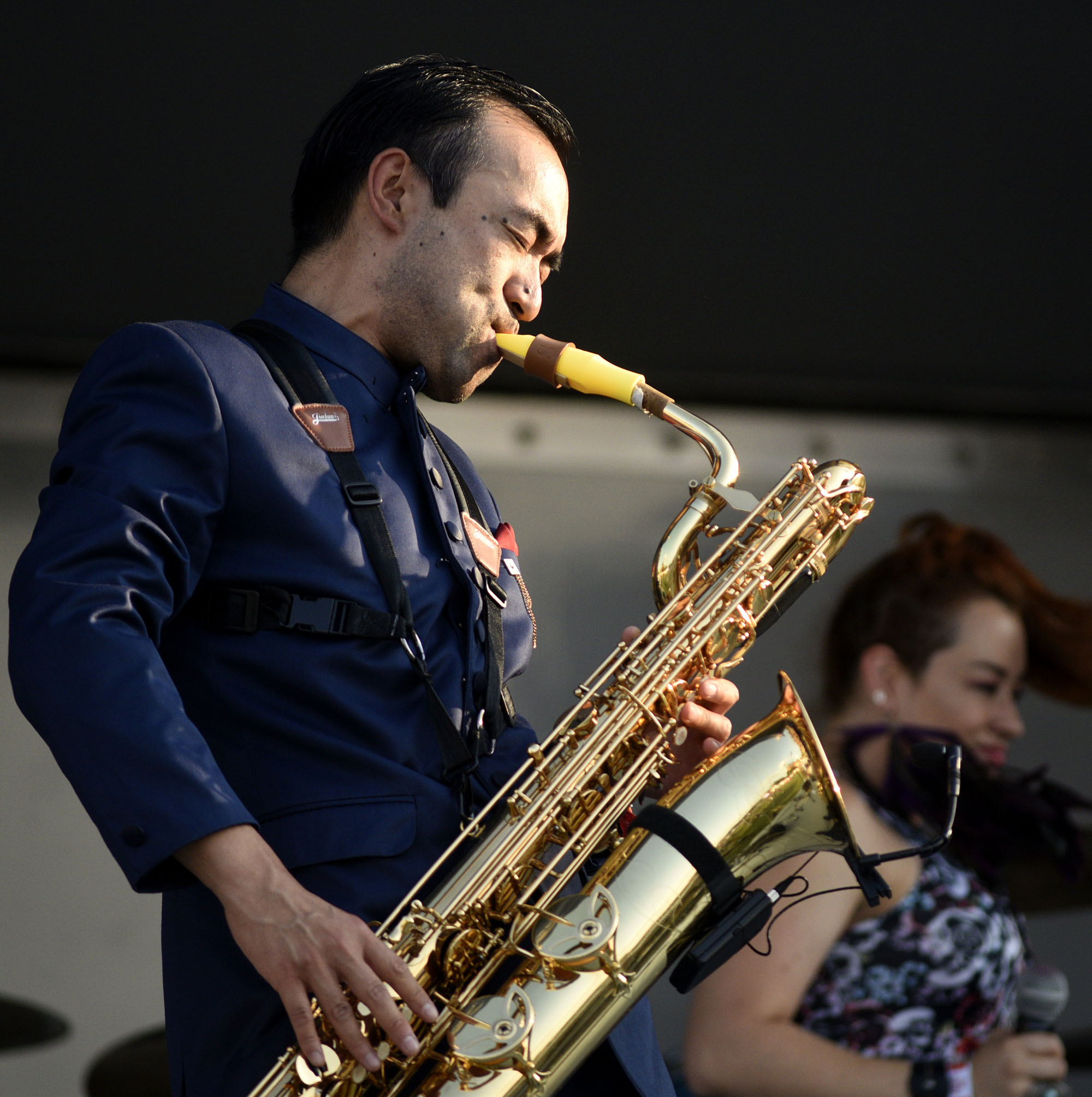 Justin Chin plays the baritone sax for La Misa Negra on the Chevy Stage.
