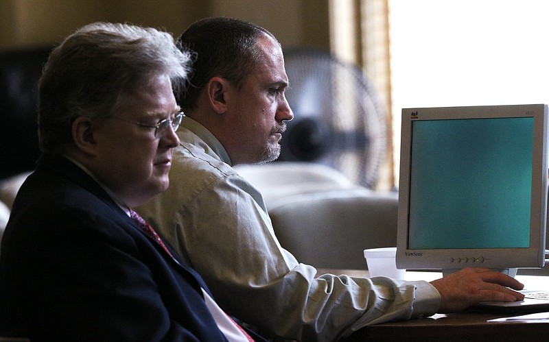 Defense attorney Joshua Smith and his client, Robert Eric Owenby, listen to testimony during Owenby's court hearing Monday, June 3, 2019 in Walker County Superior Court in LaFayette, Georgia. Owenby is charged with two counts of aggravated assault, two counts of obstruction of officers, fleeing or attempting to elude a police officer, and other charges.