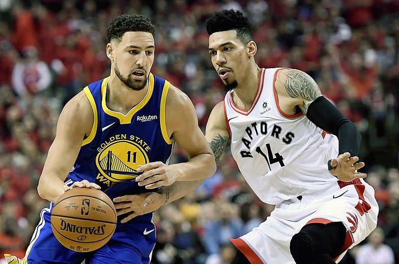 Toronto Raptors guard Danny Green (14) pressures Golden State Warriors guard Klay Thompson (11) as he drives down court during the first half of Game 2 of basketball s NBA Finals, Sunday, June 2, 2019, in Toronto. (Frank Gunn/The Canadian Press via AP) 