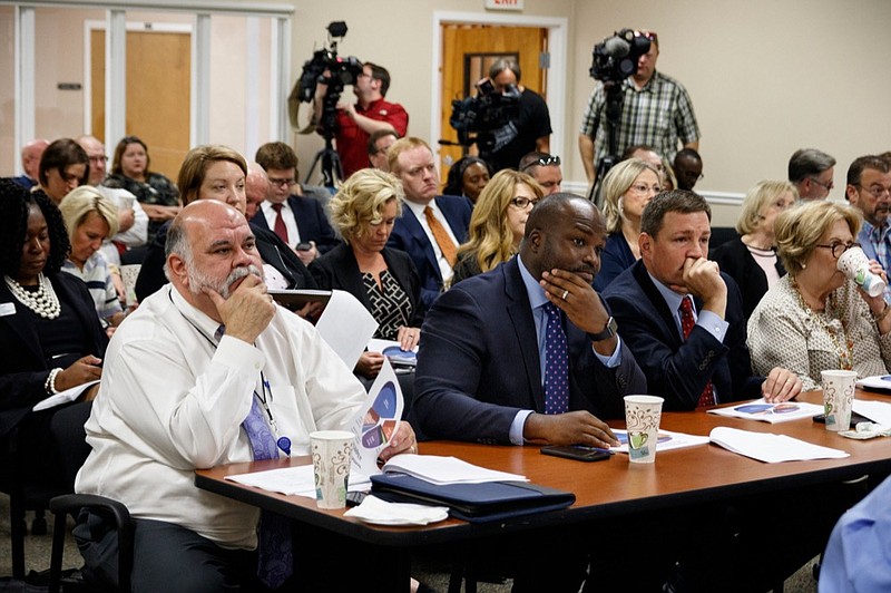 People listen as Mayor Jim Coppinger presents his fiscal year 2020 budget during a budget workshop at Hamilton County's McDaniel Building on Tuesday, June 4, 2019, in Chattanooga, Tenn. Coppinger is requesting additional funding for public safety and schools in his fiscal year 2020 budget proposal.