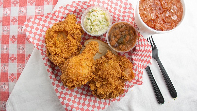 Champy's three-piece dark meat plate comes with beans, slaw and white bread for $9.25. / Facebook.com Photo