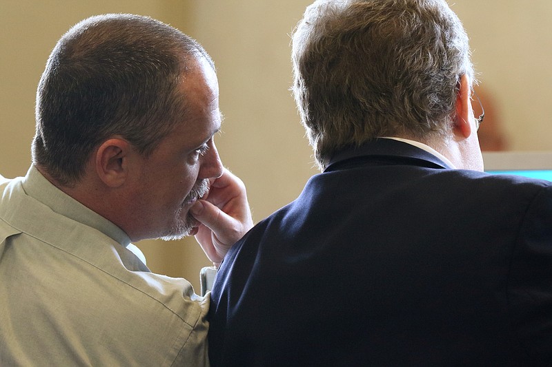 Staff photo by Erin O. Smith / Robert Eric Owenby speaks with his attorney Joshua Smith during his court hearing Monday, June 3, 2019 in Walker County Superior Court in LaFayette, Georgia. Owenby is charged with two counts of aggravated assault, two counts of obstruction of officers, fleeing or attempting to elude a police officer, and other charges.