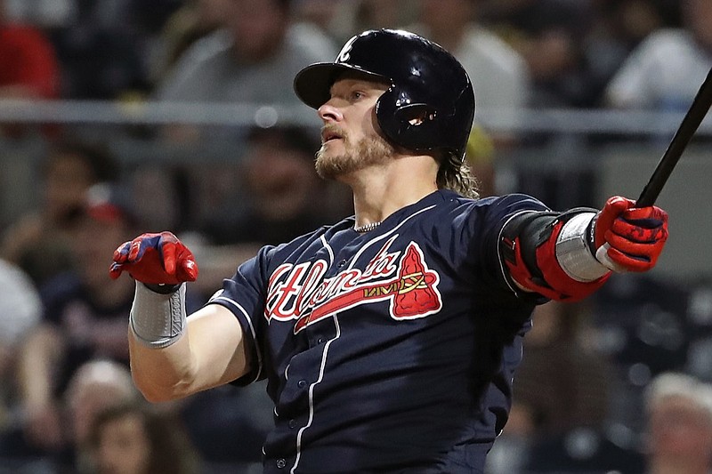 Atlanta Braves' Josh Donaldson watches his three-run home run off Pittsburgh Pirates relief pitcher Geoff Hartlieb during the eighth inning of a baseball game in Pittsburgh, Tuesday, June 4, 2019. (AP Photo/Gene J. Puskar)