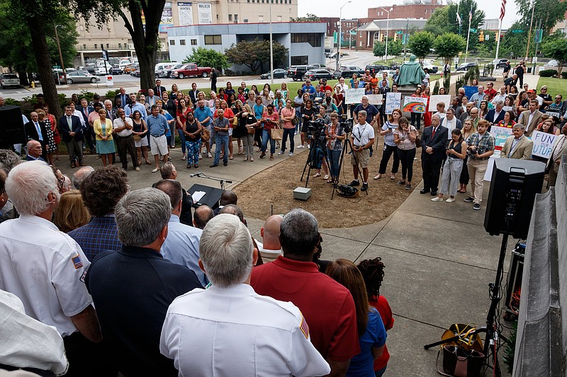 People gather to watch a news conference outside the Hamilton County Courthouse in support of Hamilton County Mayor Jim Coppinger's fiscal year 2020 budget on Wednesday, June 5, 2019, in Chattanooga, Tenn. Mayor Coppinger later presented his budget, which calls for a tax increase for additional funding for schools, to the county commission.