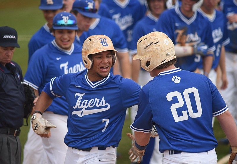 Andre Tarver, left, celebrates with Ringgold High School teammate Dalton Schley after hitting a home run during a game this past season. Tarver, who was a senior, was selected by the San Diego Padres on Wednesday in the 15th round of the MLB draft.