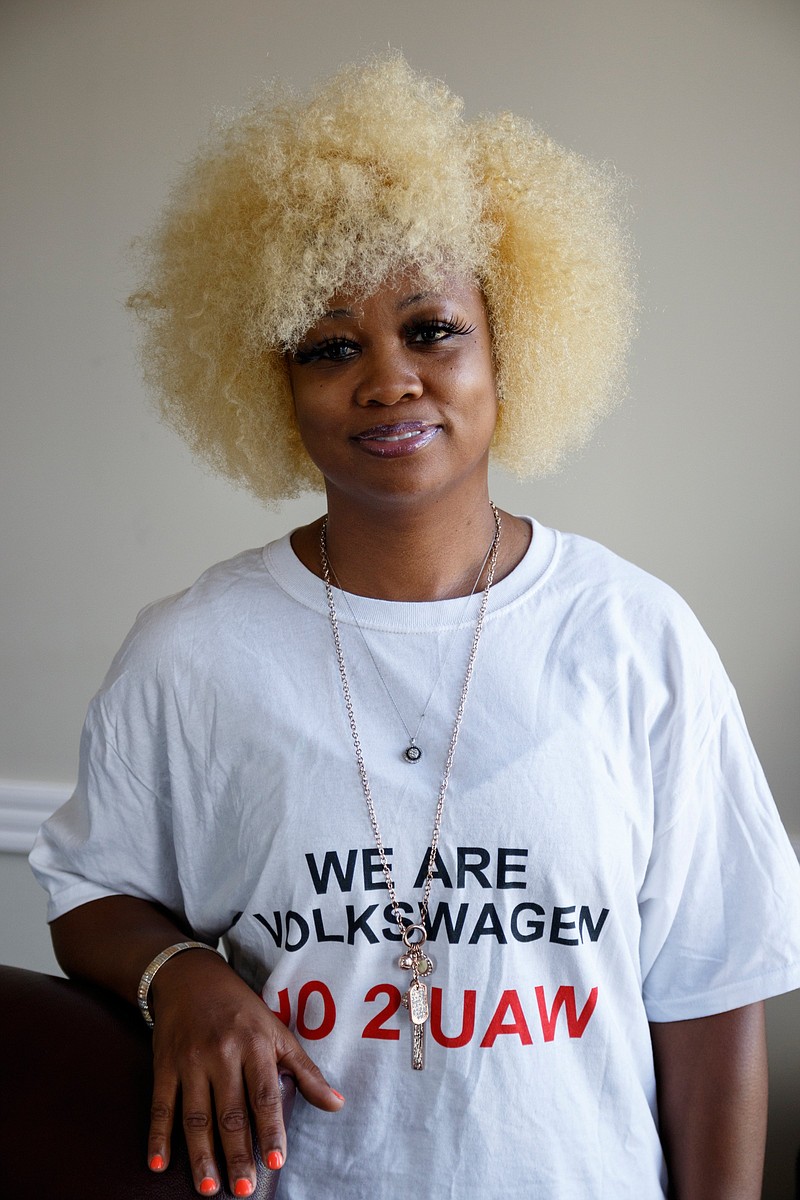 Volkswagen employee Comekia Mikes poses for a portrait in the law offices of Evans Harrison Hackett PLLC on Friday, May 31, 2019, in Chattanooga, Tenn. Mikes is one of a group of employees opposes the unionization of Chattanooga's Volkswagen plant by the United Automobile Workers of America.