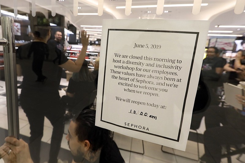 Sephora employees gather in one of the company's closed stores, in New York, Wednesday, June 5, 2019. Sephora is closing its U.S. stores for an hour Wednesday to host inclusion workshops for its employees, just over a month after R&B star SZA said she had security called on her while shopping at a store in California. (AP Photo/Richard Drew)

