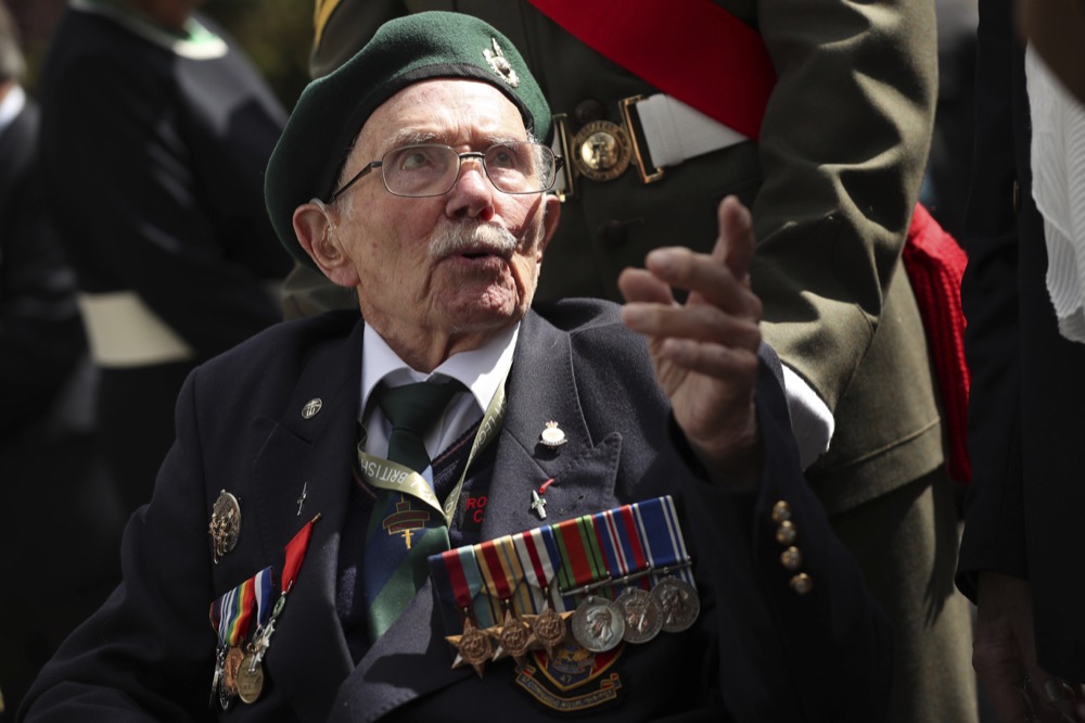 A World War II veteran arrives to the Bayeux War Cemetery for a ceremony to mark the 75th anniversary of D-Day in Bayeux, Normandy, France, Thursday, June 6, 2019. World leaders gathered Thursday in France to mark the 75th anniversary of the D-Day landings.(AP Photo/Francisco Seco)