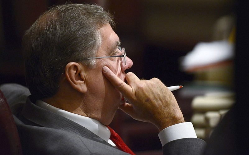 In a Feb. 12, 2014, file photo, Rep. Steve Hurst, R-Munford, watches discussion on the house floor in the Alabama Statehouse in Montgomery, Ala. Alabama lawmakers have approved legislation that would require certain sex offenders to be chemically castrated before being released on parole. The Alabama bill, sponsored by Republican Rep. Steve Hurst, would require sex offenders whose crimes involved children younger than 13 to receive the medication before being released from prison on parole. They would then be required to continue the medication until a judge decided they could stop. (Mickey Welsh/Montgomery Advertiser via AP)