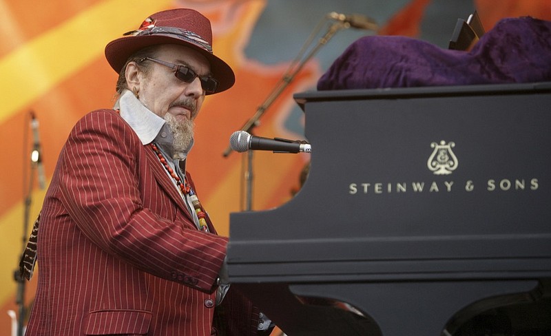 In this April 26, 2008 file photo, Dr. John performs during the 2008 New Orleans Jazz & Heritage Festival in New Orleans. The family of the Louisiana-born musician known as Dr. John says the celebrated singer and piano player who blended black and white musical influence with a hoodoo-infused stage persona and gravelly bayou drawl, has died. He was 77. A family statement released by his publicist says Dr. John, who was born Mac Rebennack, died early Thursday of a heart attack. (AP Photo/Dave Martin, File)