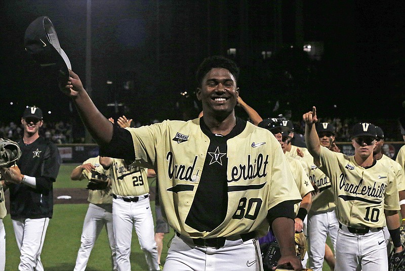 Vanderbilt's Kumar Rocker tips his hat to fans after throwing a no-hitter Saturday night against Duke in an NCAA super regional game in Nashville.