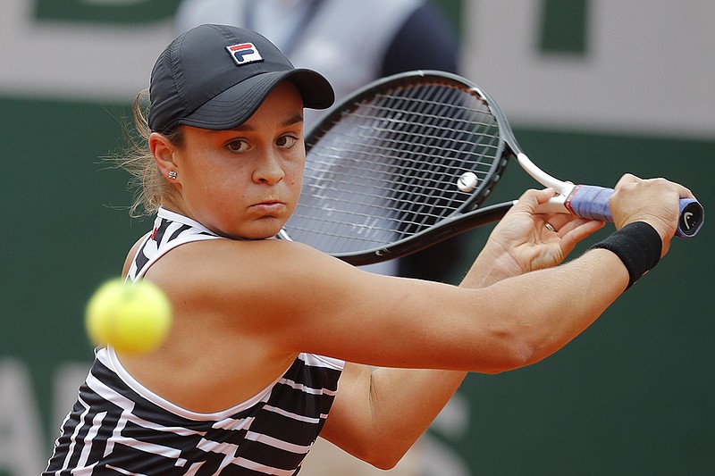 Australia's Ashleigh Barty returns a shot to Marketa Vondrousova of the Czech Republic during the women's singles final at the French Open on Saturday in Paris. Barty won 6-1, 6-3 for her first major championship.