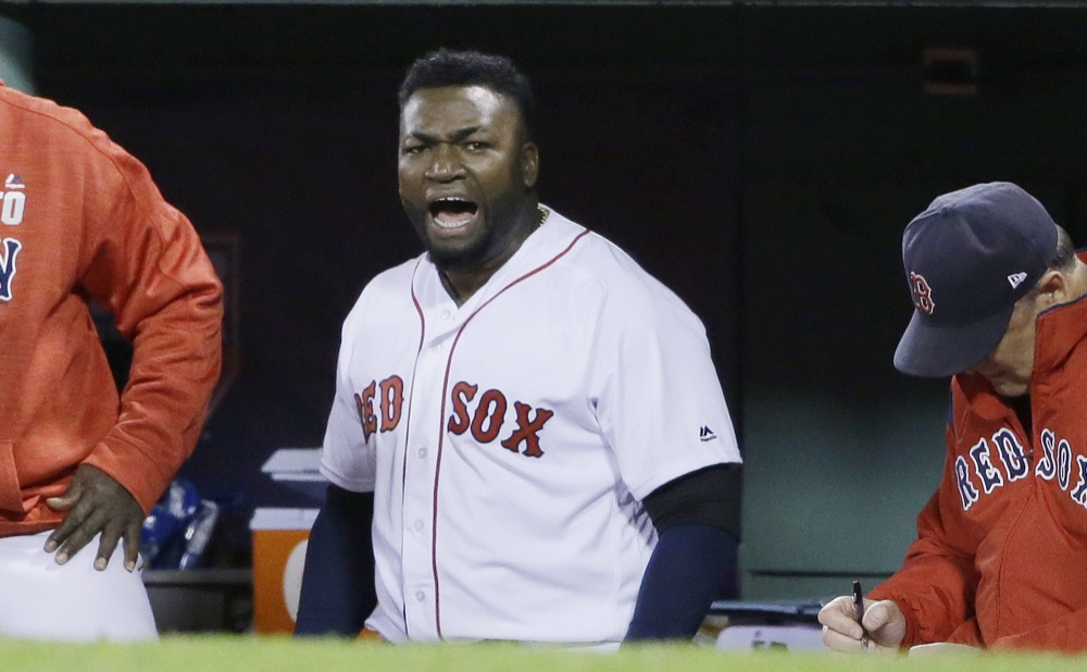 Boston Red Sox designated hitter David Ortiz encourages the crowd from the dugout during the eighth inning in Game 3 of baseball's American League Division Series against the Cleveland Indians, Monday, Oct. 10, 2016, in Boston. (AP Photo/Elise Amendola)