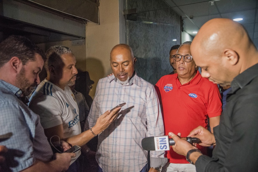 Leo Ortiz, center, father of former Boston Red Sox star David Ortiz talks with journalists at the hospital where his son was hospitalized after being shot in Santo Domingo, Dominican Republic, Sunday, June 9, 2019. (AP Photo / Ricardo Hernandez)