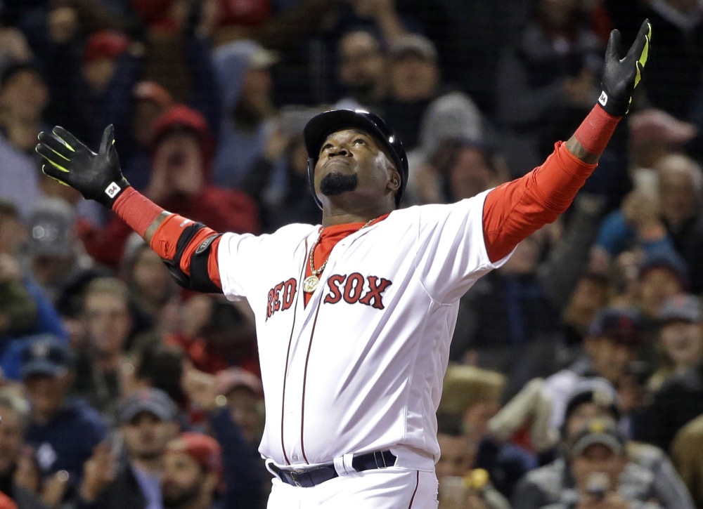 FILE - In this April 29, 2016, file photo, Boston Red Sox designated hitter David Ortiz celebrates his two-run home run against the New York Yankees during the eighth inning of a baseball game at Fenway Park, in Boston. Former Boston Red Sox slugger David Ortiz was hospitalized Monday following surgery for a gunshot wound after being ambushed by a man in a bar in his native Dominican Republic, authorities said. Dominican National Police Director Ney Aldrin Bautista Almonte said Ortiz was at the Dial Bar and Lounge in Santo Domingo around 8:50 p.m. Sunday, June 9, 2019, when a gunman approached from behind and shot him at close range. Ortiz was taken to the Abel Gonzalez clinic, where he underwent surgery, and his condition was stable, Bautista said.. (AP Photo/Elise Amendola, File)