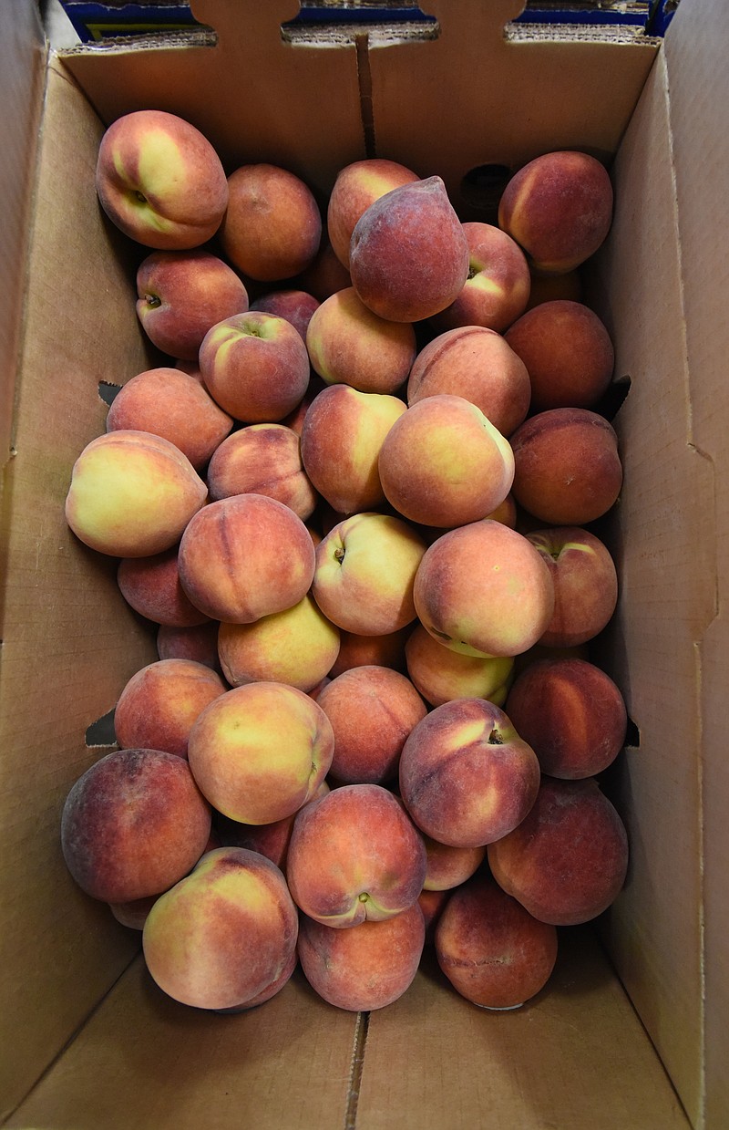 Peaches are sold by the 25-pound box, packed by weight, not quantity of peaches. Cost is $42.