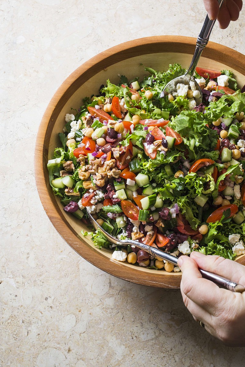 This undated photo provided by America's Test Kitchen in June 2019 shows Mediterranean Chopped Salad.  This recipe appears in the cookbook "Nutritious Delicious." (Carl Tremblay/America's Test Kitchen via AP)