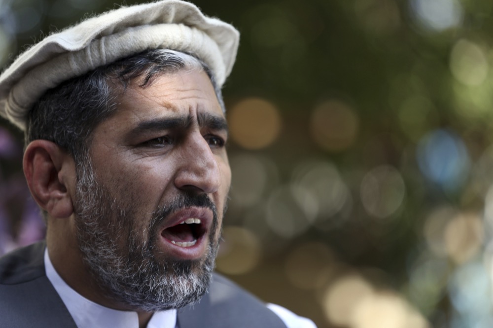 In this Thursday, May 30, 2019, photo, Ajmal Omar a member of the Nangarhar provincial council speaks during an interview with the Associated Press in the city of Jalalabad east of Kabul, Afghanistan, (AP Photo/Rahmat Gul)
