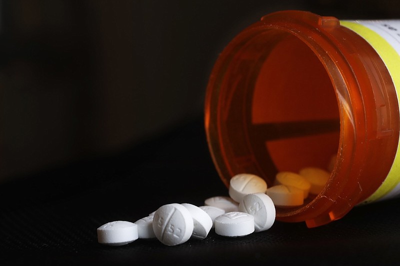 FILE - This Aug. 29, 2018, file photo shows an arrangement of Oxycodone pills in New York. A new study shoots down the notion that medical marijuana laws can prevent opioid overdose deaths. Chelsea Shover of Stanford University School of Medicine and colleagues reported the findings Monday, June 10, in Proceedings of the National Academy of Sciences. (AP Photo/Mark Lennihan, File)

