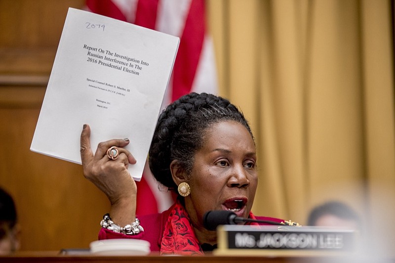 Rep. Sheila Jackson Lee, D-Texas, holds up a document titled "Report on the Investigation Into Russian Interference in the 2016 Presidential Election" as she speaks during a House Judiciary Committee hearing on the Mueller Report on Capitol Hill in Washington, Monday, June 10, 2019. (AP Photo/Andrew Harnik)

