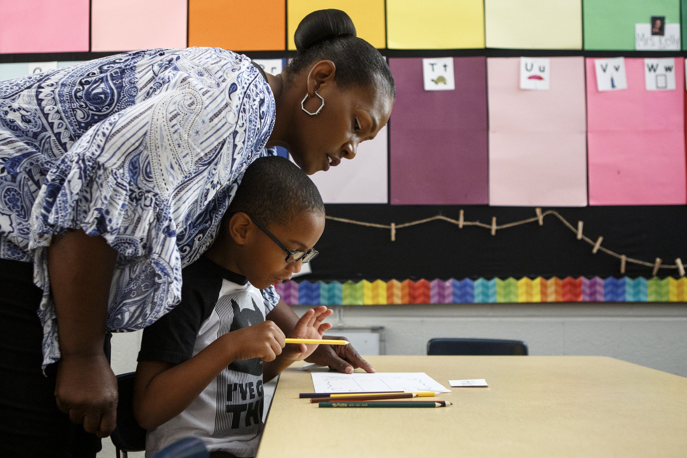 Education assistant Patricia Eady helps Halo during Camp K at Bess T. Shepherd Elementary School on Tuesday, June 11, 2019 in Chattanooga, Tenn. During the month of June, Camp K is providing over 400 rising kindergartners across 15 Hamilton County public schools access to foundational English and literacy skills and social-emotional experiences.
