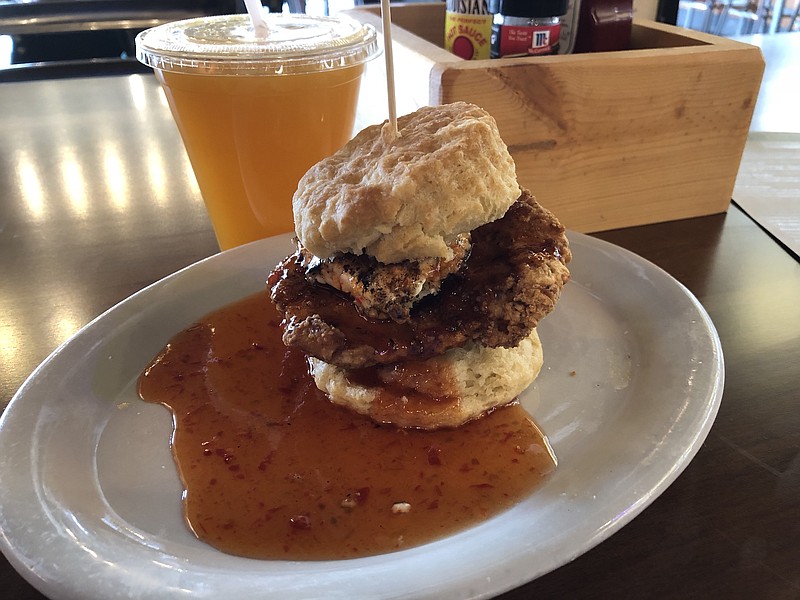 The Squawking Goat at Maple Street Biscuit Company fills a house-made biscuit with fried chicken breast and goat cheese. Fresh-squeezed orange juice completed the order.