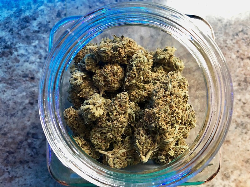 In this photo taken April 8, 2019, a jar of medical marijuana sits on the counter at Western Oregon Dispensary in Sherwood, Ore. The dispensary is one of two medical-only marijuana dispensaries left in Oregon. Broad legalization of marijuana in Oregon has been devastating for the medical cannabis industry, with the number of medical stores falling from 400 to two in just a few years. The medical marijuana program in Oregon, one of nation's first, is collapsing as broad legalization expands. (AP Photo/Gillian Flaccus)