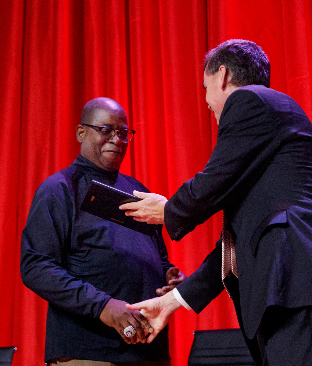 David Paschall, right, awards Glenn Swafford the Sandy Sandlin Unselfish Sportsman award during the Times Free Press's Best of Preps Banquet at the Chattanooga Convention Center on Tuesday, June 11, 2019, in Chattanooga, Tenn. Former Tennessee basketball player Admiral Schofield was the guest athlete at the dinner honoring area high school athletes.