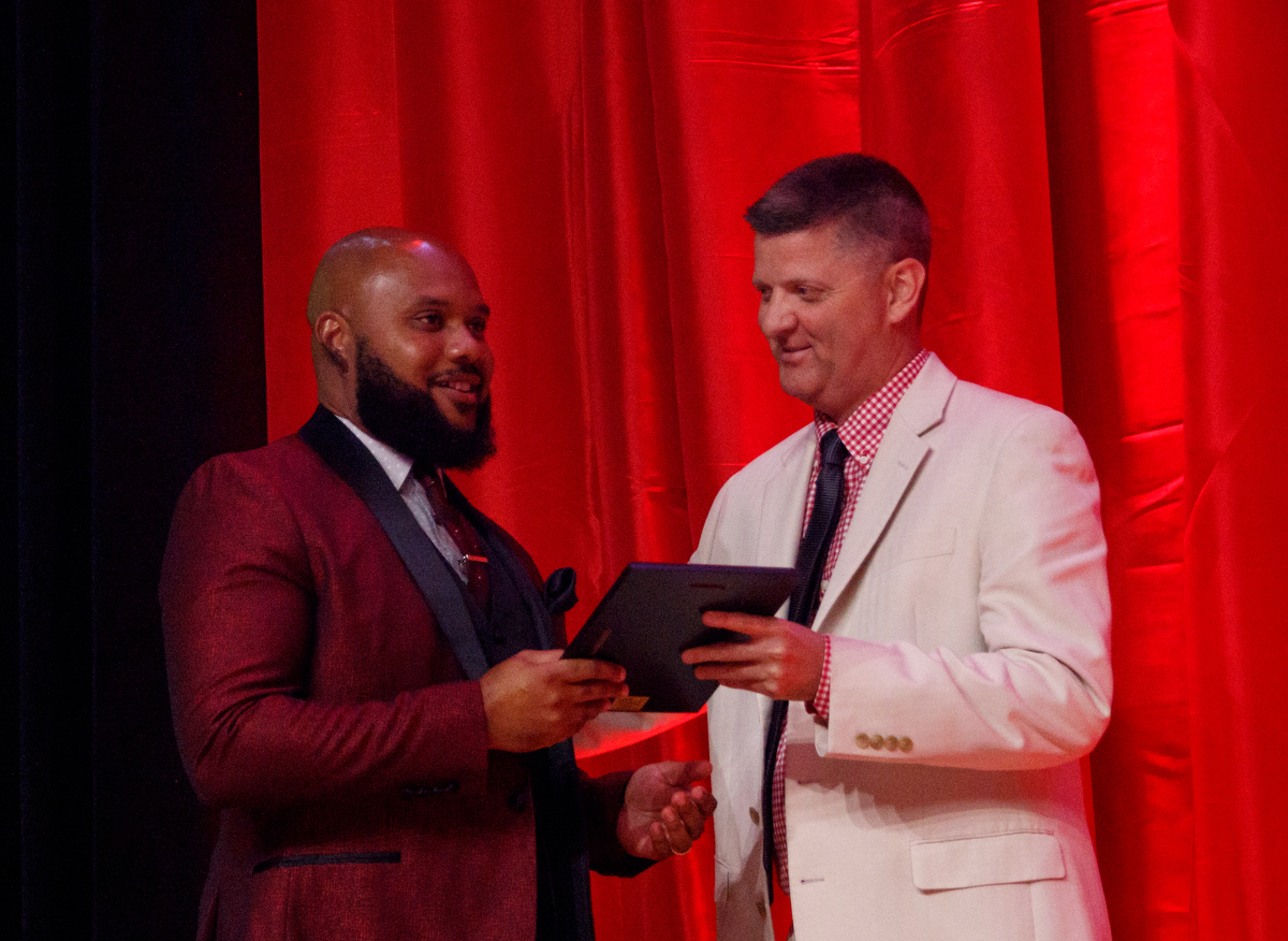 Stephen Hargis, right, awards LaDarrius Price the Guy Francis Going the Extra Mile award during the Times Free Press's Best of Preps Banquet at the Chattanooga Convention Center on Tuesday, June 11, 2019, in Chattanooga, Tenn. Former Tennessee basketball player Admiral Schofield was the guest athlete at the dinner honoring area high school athletes.