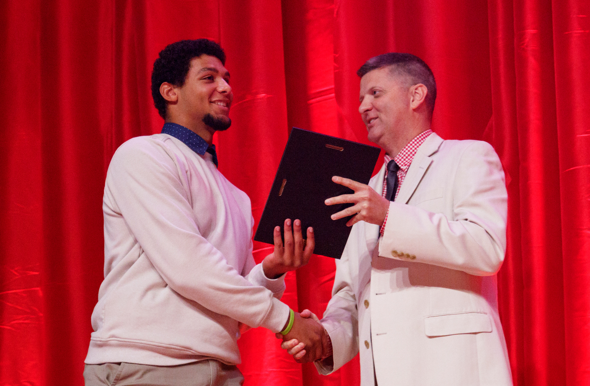 Stephen Hargis, right, awards Ringgold athlete Andre Tarver the Scrappy Moore Male Athlete of the Year award during the Times Free Press's Best of Preps Banquet at the Chattanooga Convention Center on Tuesday, June 11, 2019, in Chattanooga, Tenn. Former Tennessee basketball player Admiral Schofield was the guest athlete at the dinner honoring area high school athletes.