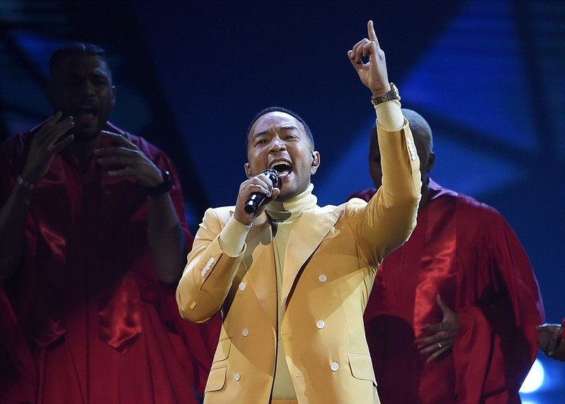 FILE - In this March 14, 2019, file photo, John Legend performs "Preach" at the iHeartRadio Music Awards at the Microsoft Theater in Los Angeles. Legend says Hollywood should consider boycotting Georgia, Louisiana, Alabama and other states that pass restrictive abortion laws. The Grammy and Oscar-winning singer says he isn t sure a boycott would lead to the states changing course, but he knows that money talks. (Photo by Chris Pizzello/Invision/AP, File)

