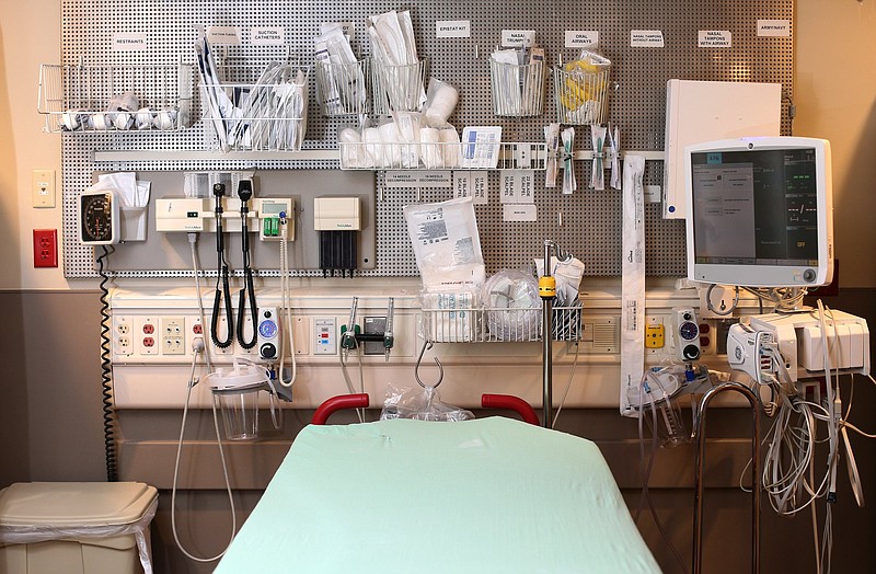 Medical supplies are organized on a wall above beds in the emergency department at Erlanger Medical Center on March 20.