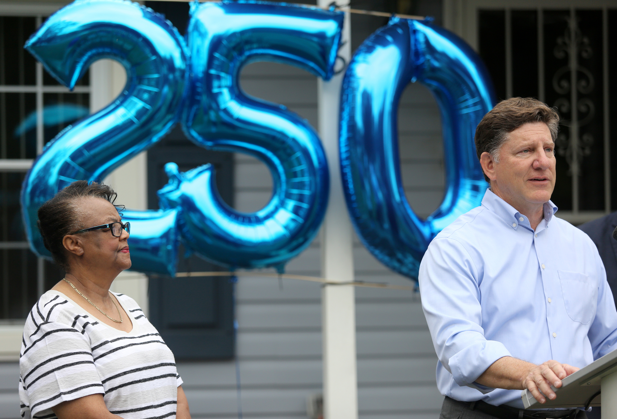 Tennessee Valley Authority CEO Jeff Lyash speaks about the Home Energy Upgrade program, as Hazel Benford, a homeowner who has benefited from the program, stands to the left of him, during a press conference Wednesday, June 12, 2019 in Chattanooga, Tennessee. The Home Energy Upgrade program is a result of a partnership between EPB, Tennessee Valley Authority and Green Spaces.