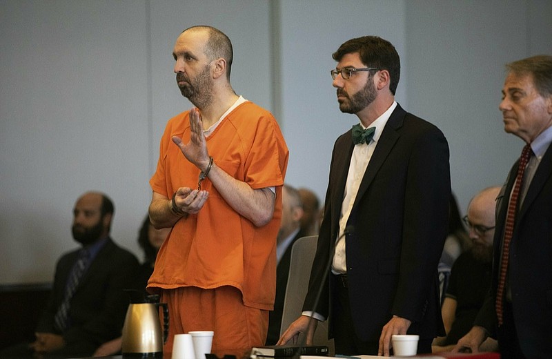 Craig Hicks pleads guilty to first-degree murder in the 2015 murders of three young Muslims at a Chapel Hill apartment Wednesday, June 12, 2019 at the Durham County Courthouse. Hicks will serve a life sentence in prison without the possibility of parole for killing his neighbors at the Finley Forest Condominiums: Deah Barakat, 23, his wife Yusor Abu-Salha, 21, and her sister Razan Abu-Salha, 19. (Travis Long/The News & Observer via AP)

