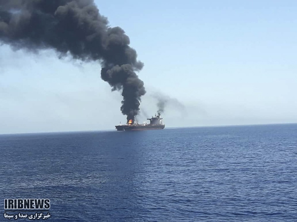 In this photo released by state-run IRIB News Agency, an oil tanker is on fire in the sea of Oman, Thursday, June 13, 2019. Two oil tankers near the strategic Strait of Hormuz have been reportedly attacked. The alleged assault on Thursday left one ablaze and adrift as sailors were evacuated from both vessels. The U.S. Navy rushed to assist amid heightened tensions between Washington and Tehran. (IRIB News Agency via AP)