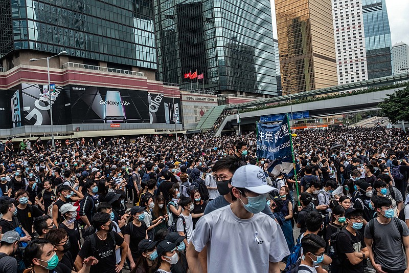 Demonstrators occupy a road that is normally a busy thoroughfare in Hong Kong last Wednesday. A top adviser to Hong Kong's leader said on Friday it would be impossible to rush through an extradition bill in the wake of clashes between the police and protesters. (Lam Yik Fei/The New York Times)