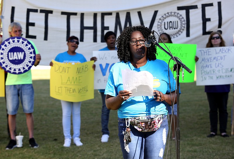 Carla Leslie of the United Steelworkers Local 15120 reads a statement during a rally for working families, laborers and community leaders held by Chattanooga Area Labor Council Monday, May 20, 2019 at Miller Park in Chattanooga, Tennessee. Leslie said she was there in support of working people and VW workers. / Staff file photo