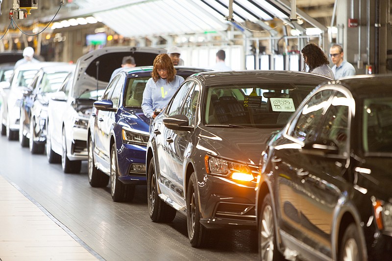 Volkswagen workers inspect new vehicles at the company's Chattanooga manufacturing plant in 2016.