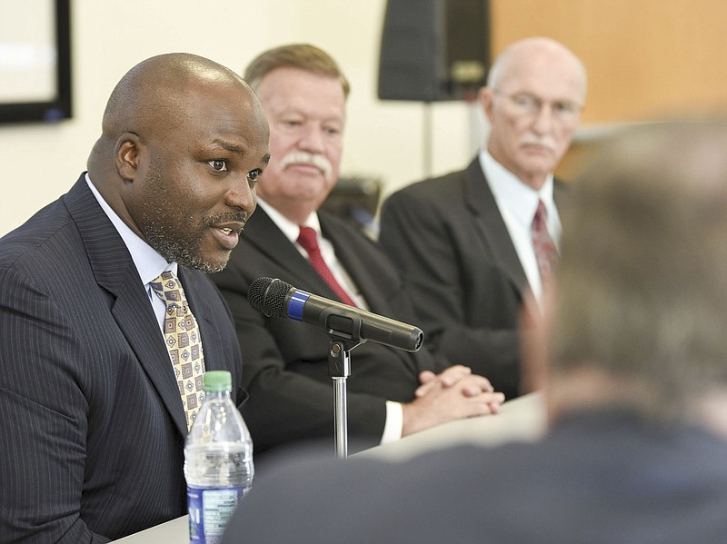 Hamilton County School Superintendent Dr. Bryan Johnson, left, speaks about wellbeing of children in the school system Monday at a roundtable discussion at the Children's Kennedy Outpatient Center.  Hamilton County Mayor Jim Coppinger, center, and Sheriff Jim Hammond listen.
