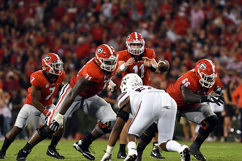 Georgia tackle Andrew Thomas (71) and guard Solomon Kindley (66) have combined for 49 career starts and this year will continue to protect quarterback Jake Fromm (11) and provide holes for running back D'Andre Swift (7).