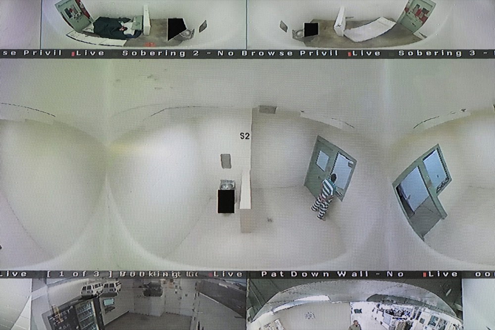** HOLD FOR STORY ATTN: PATRICK ** In this photo taken Tuesday, April 16, 2019, are video monitoring screens of holding cells in the booking are of the Lake County Jail in Lakeport, Calif. At center is the holding area where Elizabeth Gaunt committed suicide. Medication withheld, cries for help ignored, routine checks neglected: With jail suicides on the rise, an AP/University of Maryland examination raises troubling questions about whether deaths could have been avoided with more training, better technology, fewer broken rules. (AP Photo/Eric Risberg)