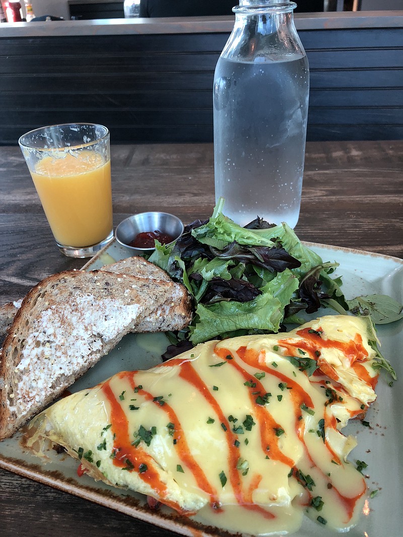 The Summer Crab Omelet is one of five new seasonal additions to the menu at First Watch. Crab, roasted corn, red peppers, cheese and scallions are enfolded in the omelet topped with hollandaise and then drizzled with Cholula. It's served with whole-grain toast, preserves and mixed greens.