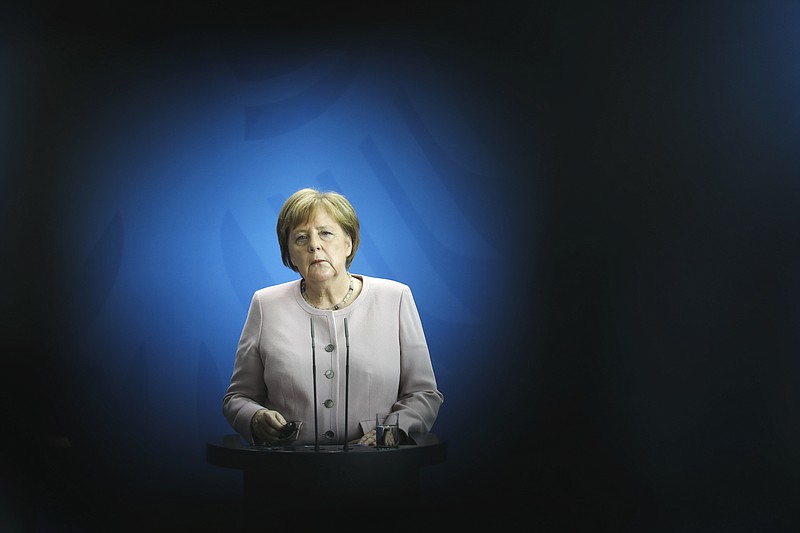 German Chancellor Angela Merkel attends a joint news conference with Ukrainian President Volodymyr Zelenskiy after a meeting at the chancellery in Berlin, Germany, Tuesday, June 18, 2019. (AP Photo/Markus Schreiber)