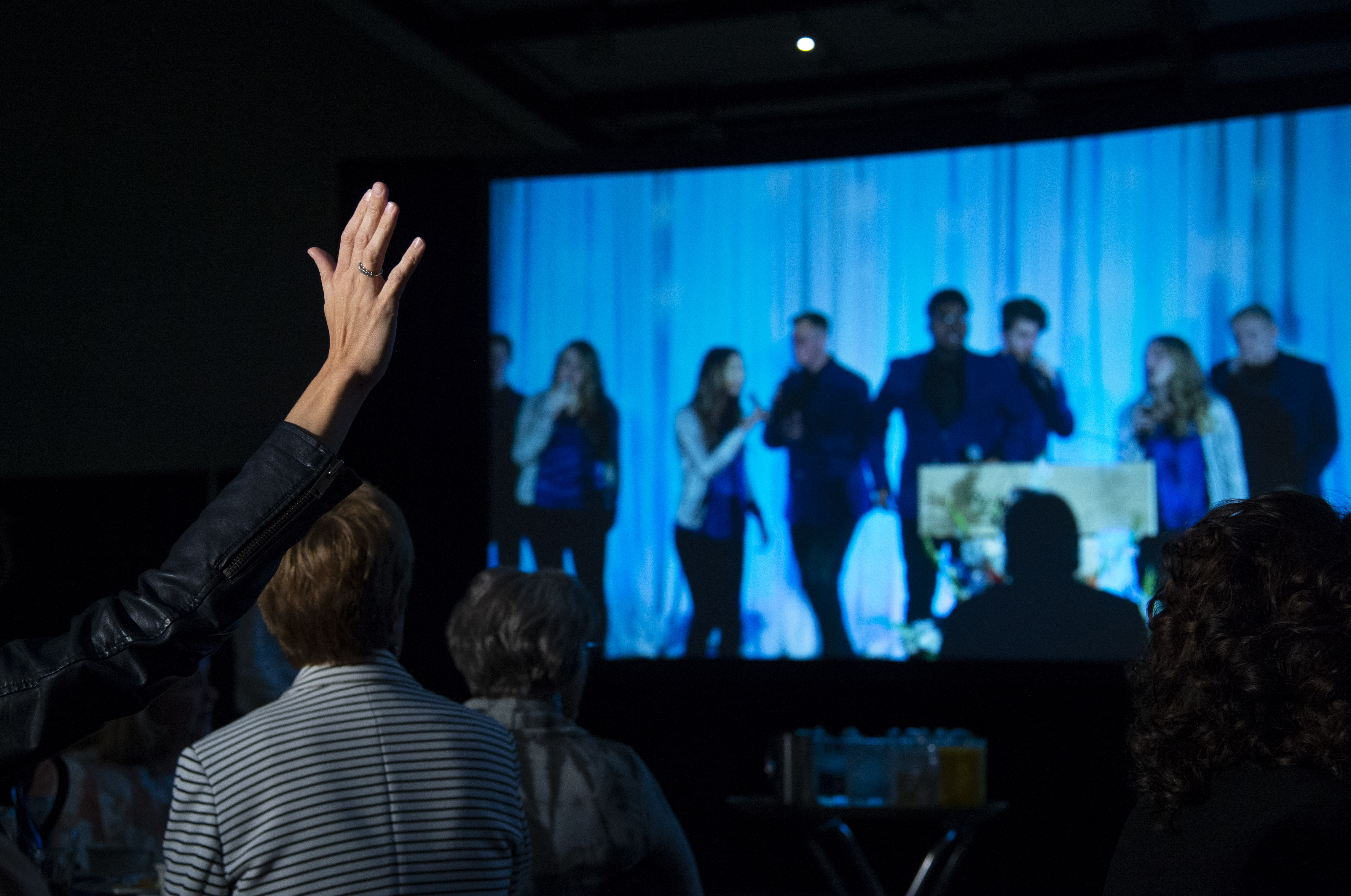 An attendee is moved by the Voices of Lee.