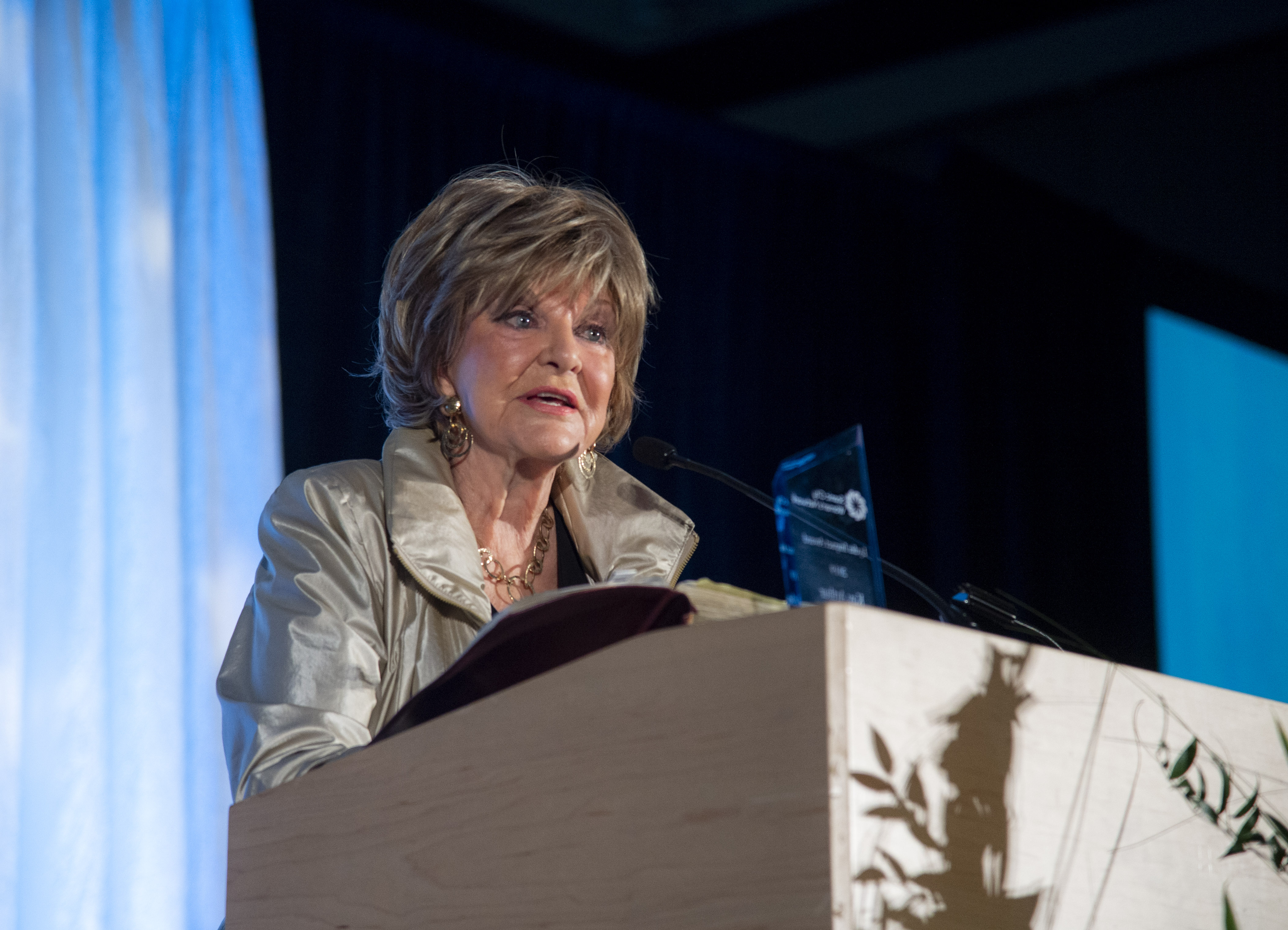 The 2019 Lydia Award winner, Kay Arthur, reads from the Bible after recieving the award.