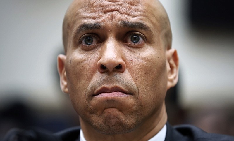 Democratic Presidential candidate Sen. Cory Booker, D-N.J., waits to testify about reparation for the descendants of slaves during a hearing before the House Judiciary Subcommittee on the Constitution, Civil Rights and Civil Liberties, at the Capitol in Washington, Wednesday, June 19, 2019. (AP Photo/Pablo Martinez Monsivais)