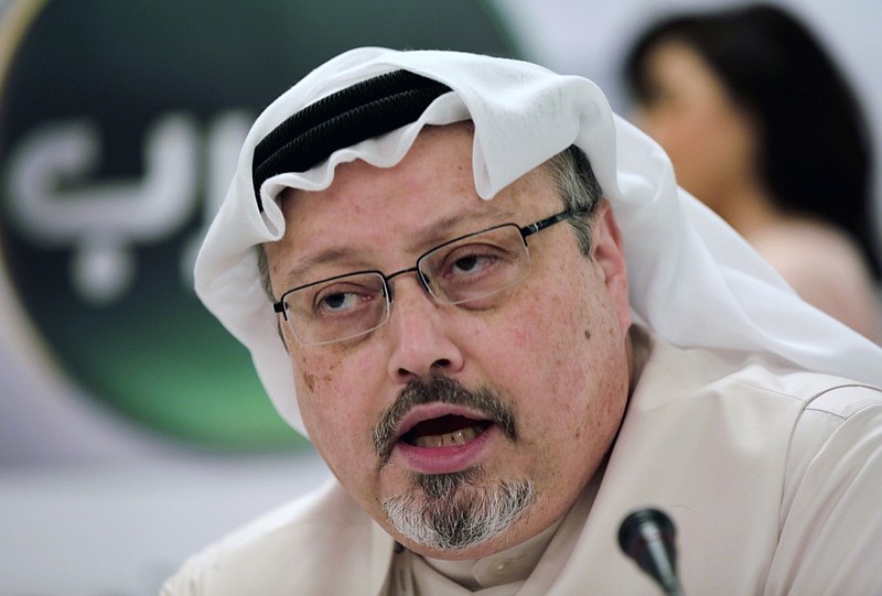In this Dec. 15, 2014, file photo, Saudi journalist Jamal Khashoggi speaks during a press conference in Manama, Bahrain. An independent U.N. human rights expert investigating the killing of Saudi journalist Jamal Khashoggi is recommending an investigation into the possible role of Saudi Crown Prince Mohammed bin Salman, citing "credible evidence." (AP Photo/Hasan Jamali, File)