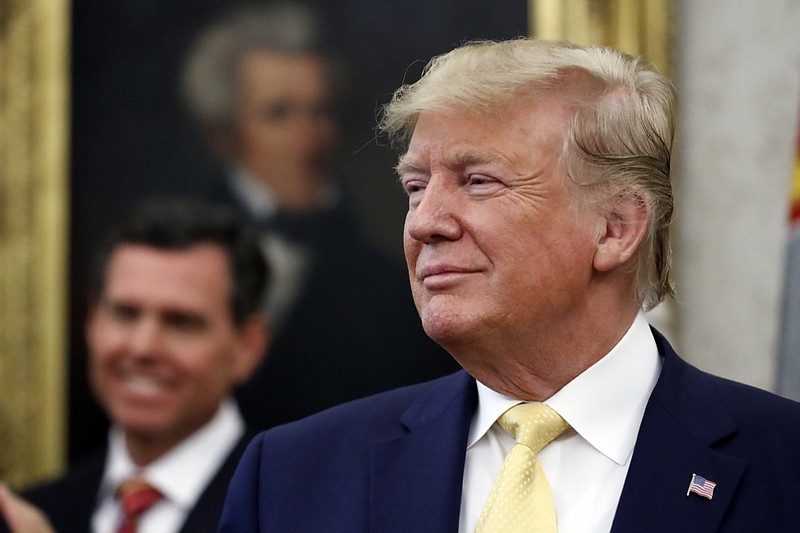 President Donald Trump listens before awarding the Presidential Medal of Freedom to economist Arthur Laffer, Wednesday June 19, 2019, in the Oval Office of the White House in Washington. (AP Photo/Jacquelyn Martin)
