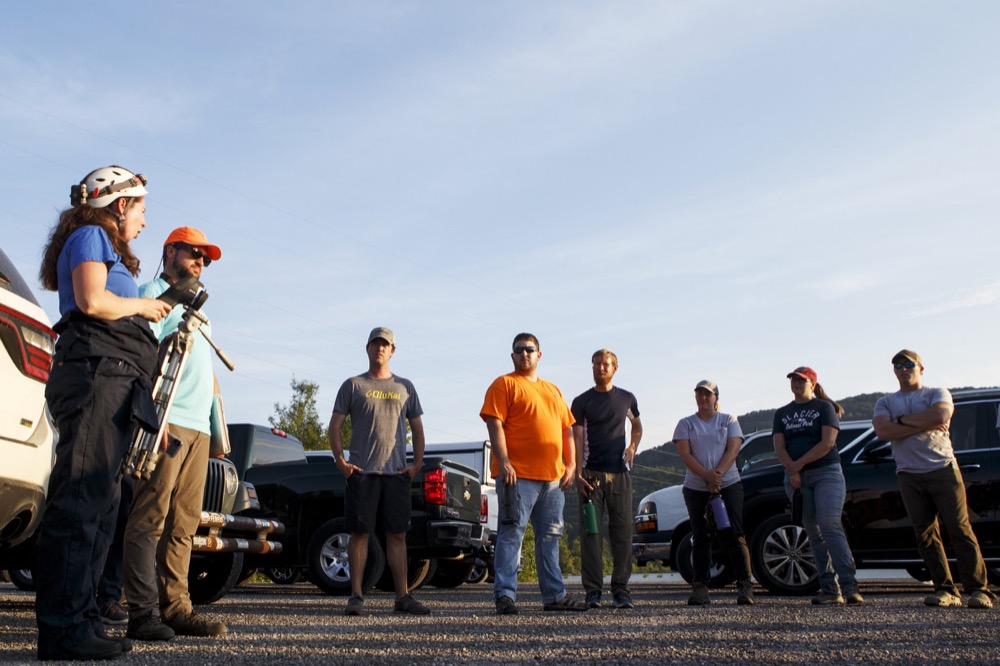TVA Terrestrial Zoologist Liz Hamrick, left, talks to a group of people before they head out to Nickajack Cave to count gray bats on Wednesday, June 19, 2019 in Marion County, Tenn. Gray bats are federally endangered and afforded protection under the Endangered Species Act.