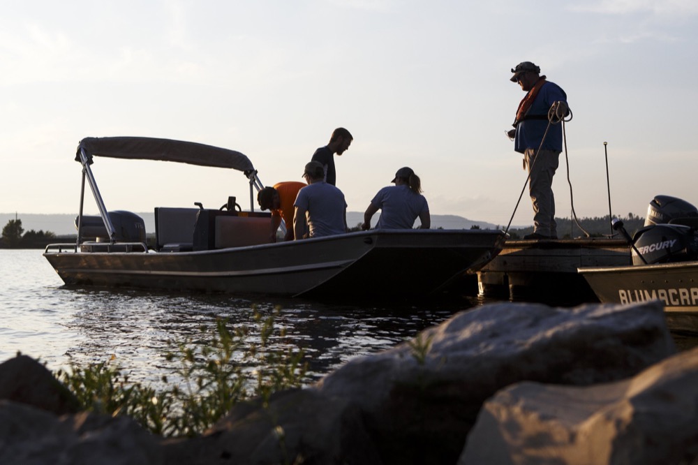 TVA Senior Specialist Josh Burnette holds a dock line before ferrying a group of people over to Nickajack Cave to help count gray bats on Wednesday, June 19, 2019 in Marion County, Tenn. Gray bats are federally endangered and afforded protection under the Endangered Species Act.